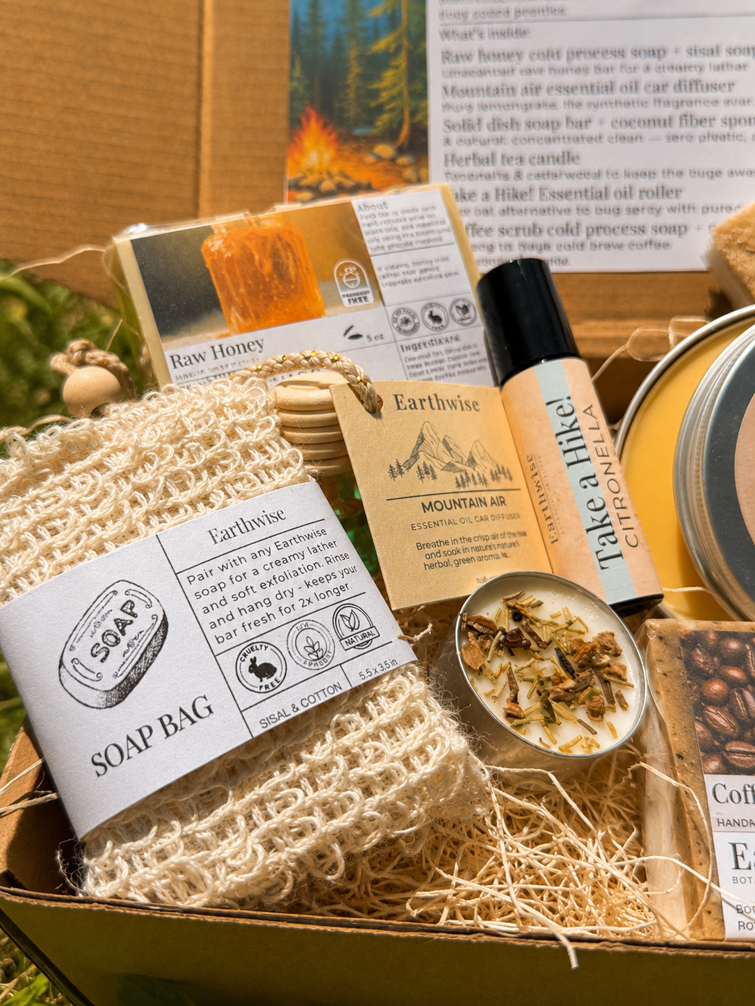 Box of natural products including soap, honey, and a mountain air diffuser.