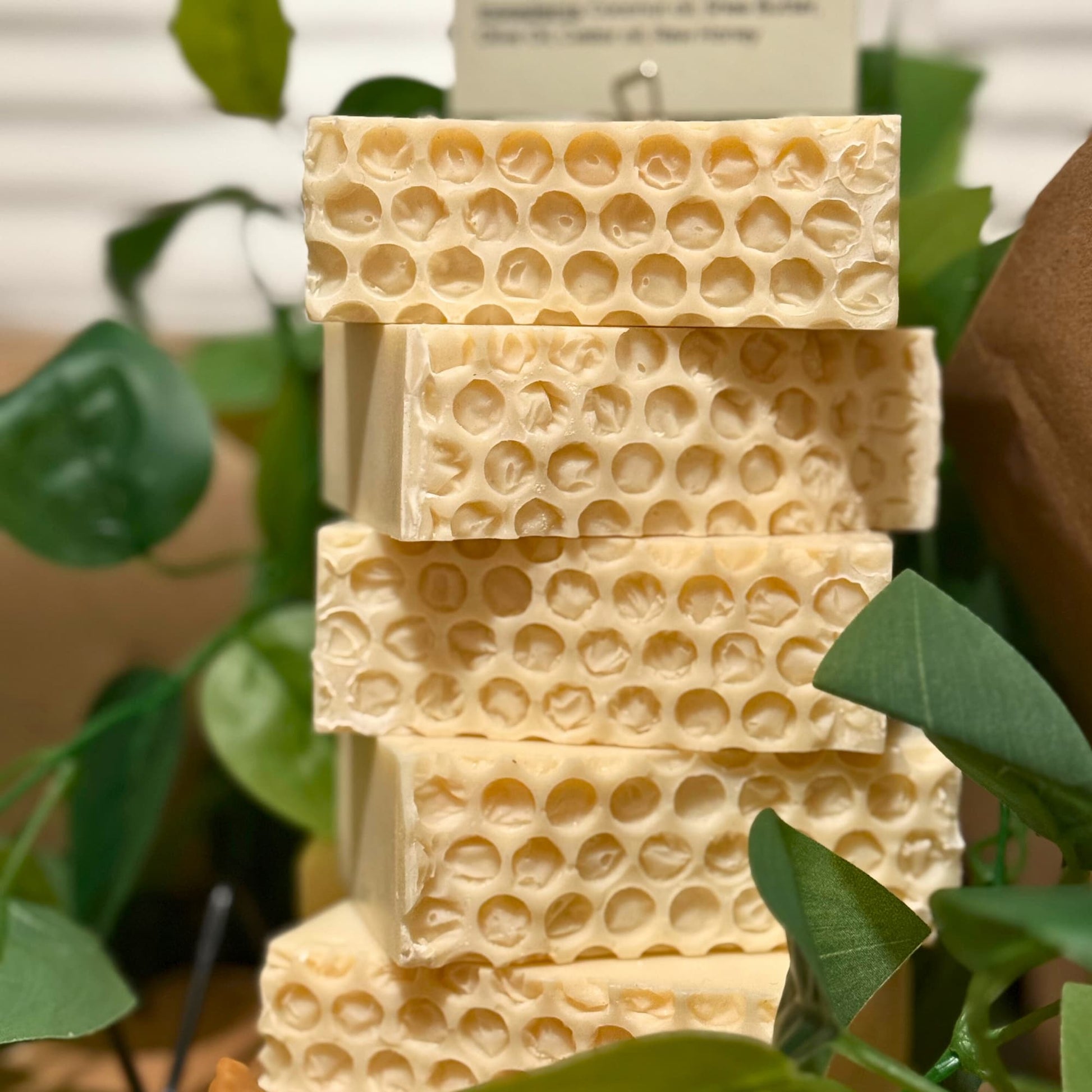 Unscented raw honey soap bar with smooth edges and honeycomb texture on the side