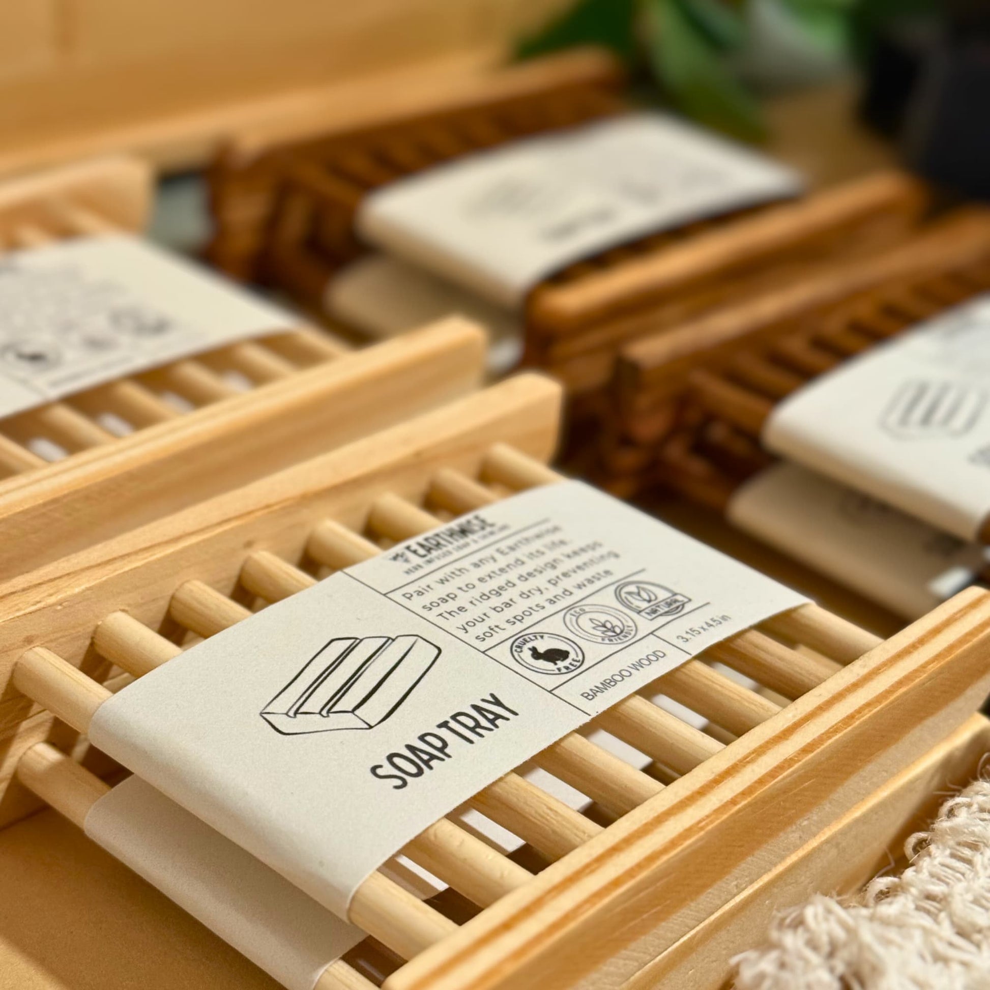 Wooden soap tray with a label on a blurred background