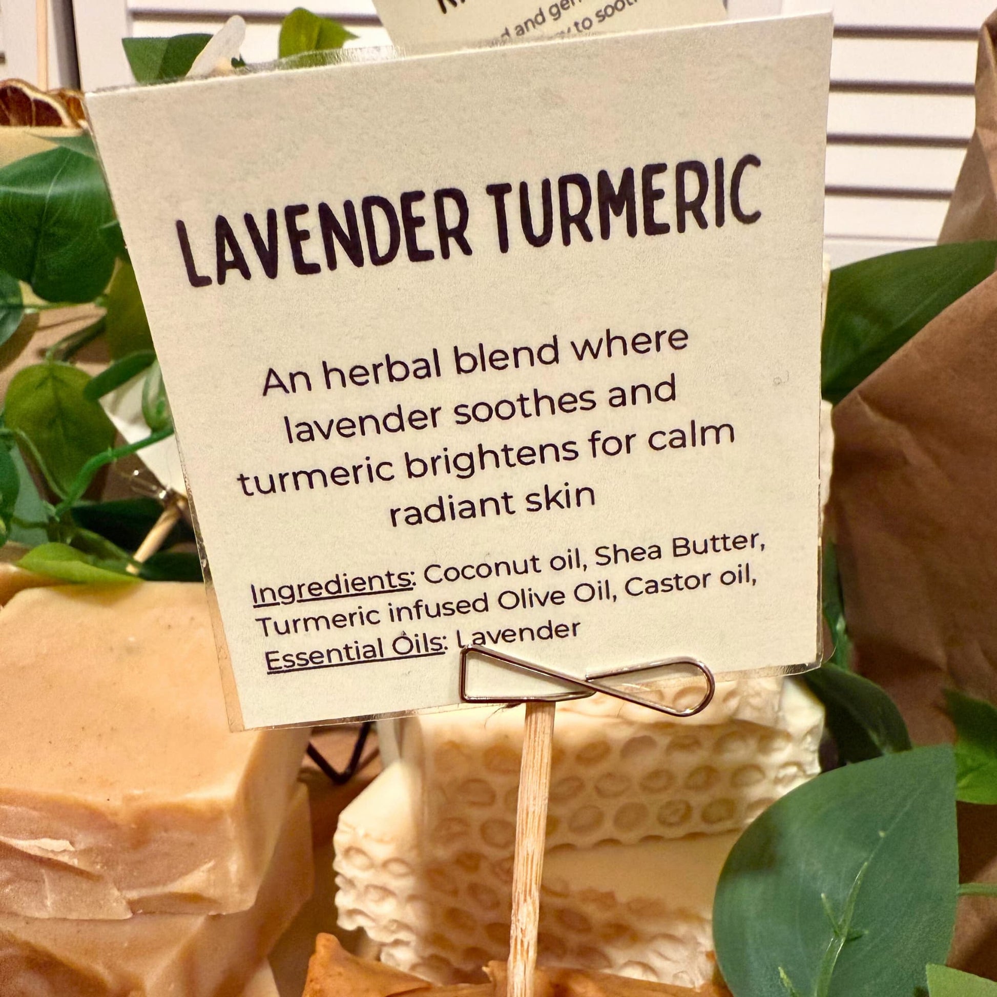 Lavender Turmeric soap with descriptive sign and greenery