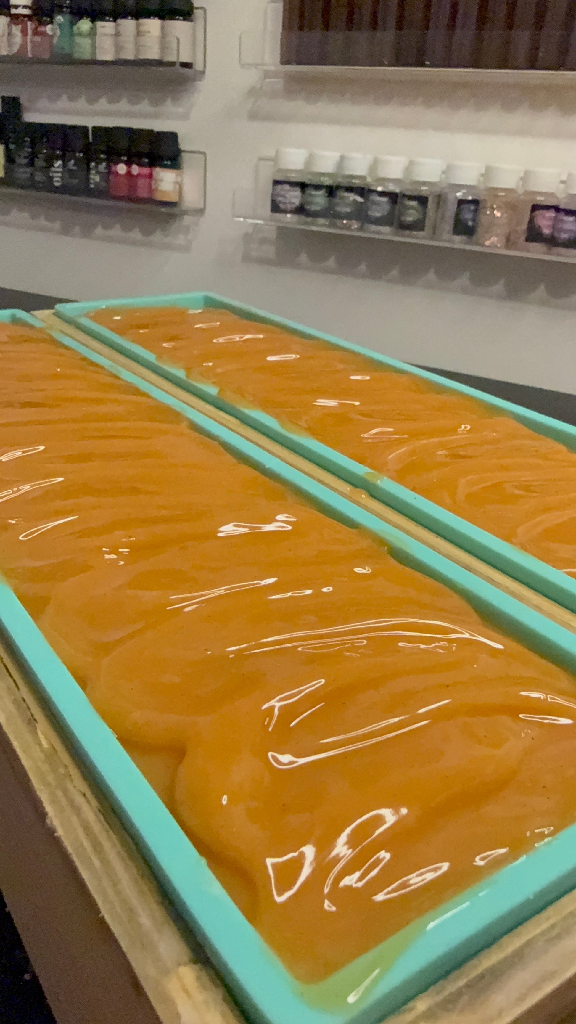 Photo of natural turmeric soap being poured into molds